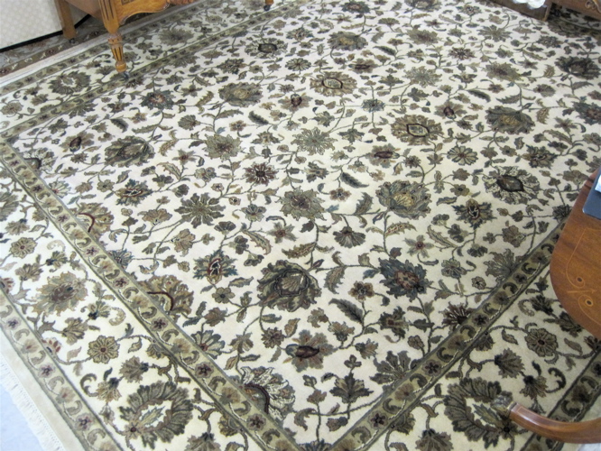 Appraisal: HAND KNOTTED ORIENTAL CARPET overall floral design on cream ground