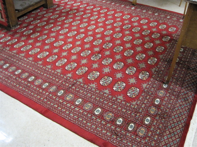 Appraisal: PAKISTANI BOKHARA CARPET repeating columns of geometric Turkoman gols on