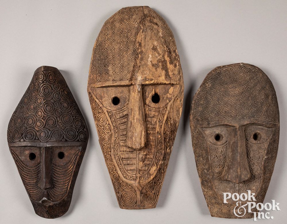 Appraisal: Three carved Timor tribal masks Three carved Timor tribal masks