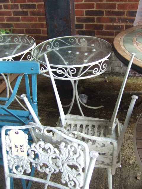 Appraisal: A pair of circular white painted wrought iron garden tables