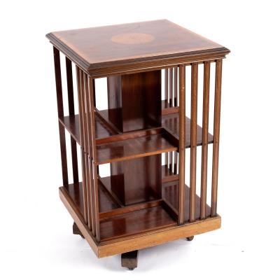 Appraisal: An Edwardian mahogany revolving bookstand banded with satinwood and strung