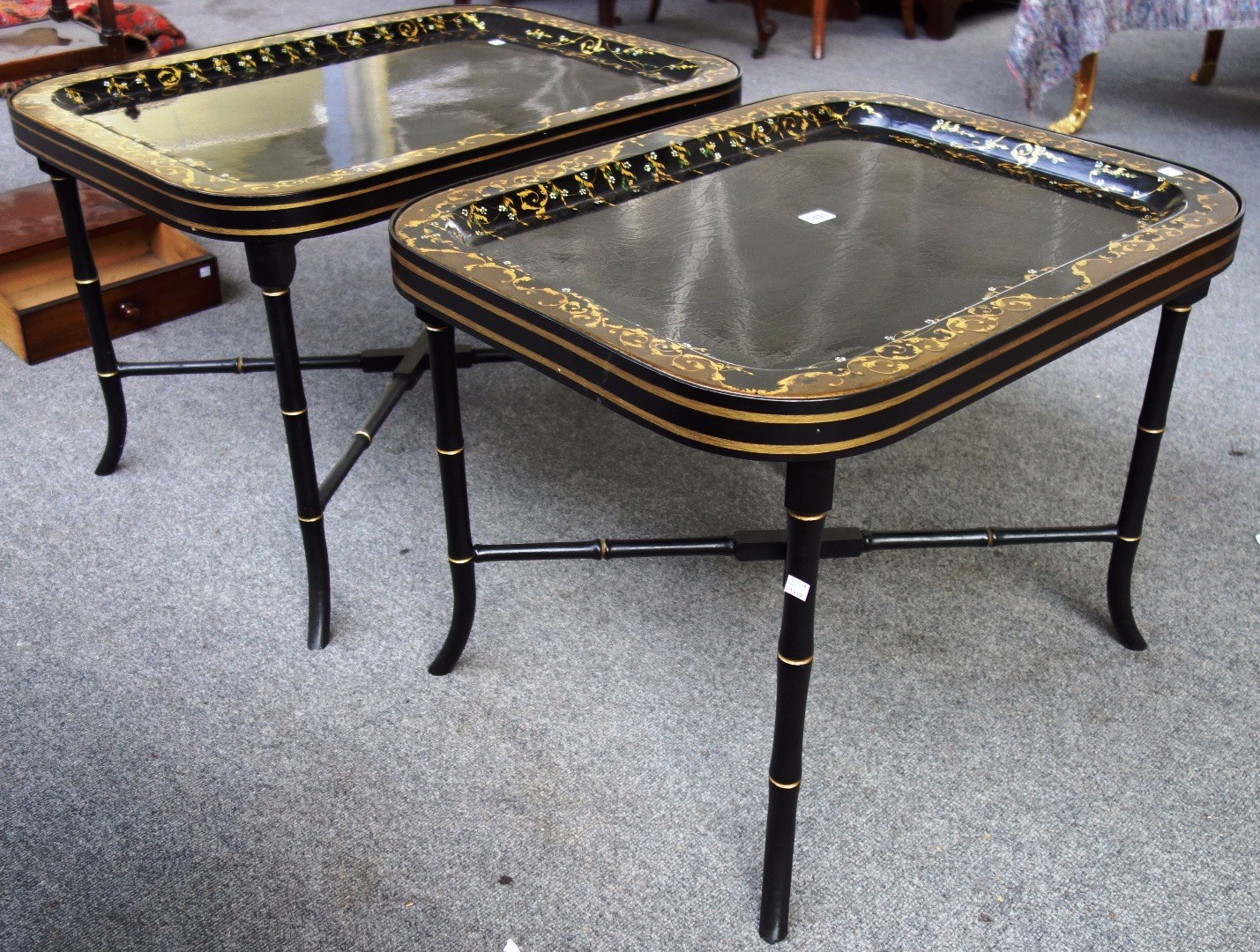 Appraisal: A graduated pair of th century black lacquer parcel gilt