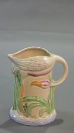 Appraisal: A Clarice Cliff relief moulded flamingo jug cms high