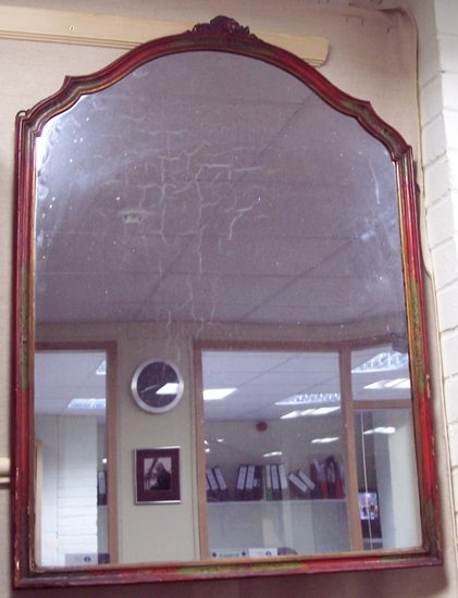 Appraisal: A red lacquer wall mirror with fluted frame painted roses