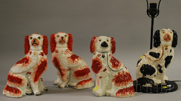 Appraisal: Four Staffordshire Seated King Charles Spaniels Figures including a pair