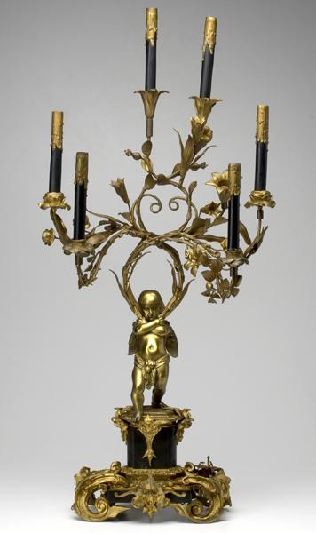 Appraisal: LIGHTING Dore bronze and black marble candelabrum with figural cherub