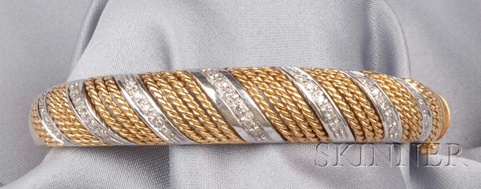 Appraisal: kt Bicolor Gold and Diamond Bracelet the hinged bangle designed