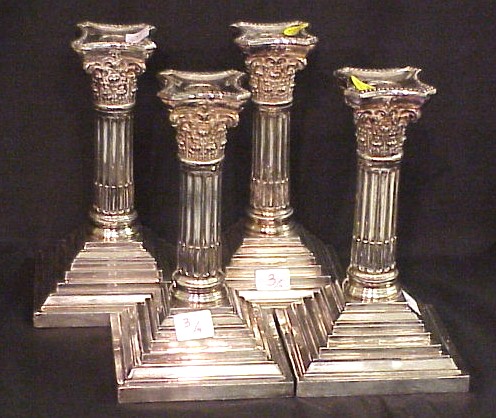 Appraisal: Set of four silverplate candlesticks Corinthian column form on stepped