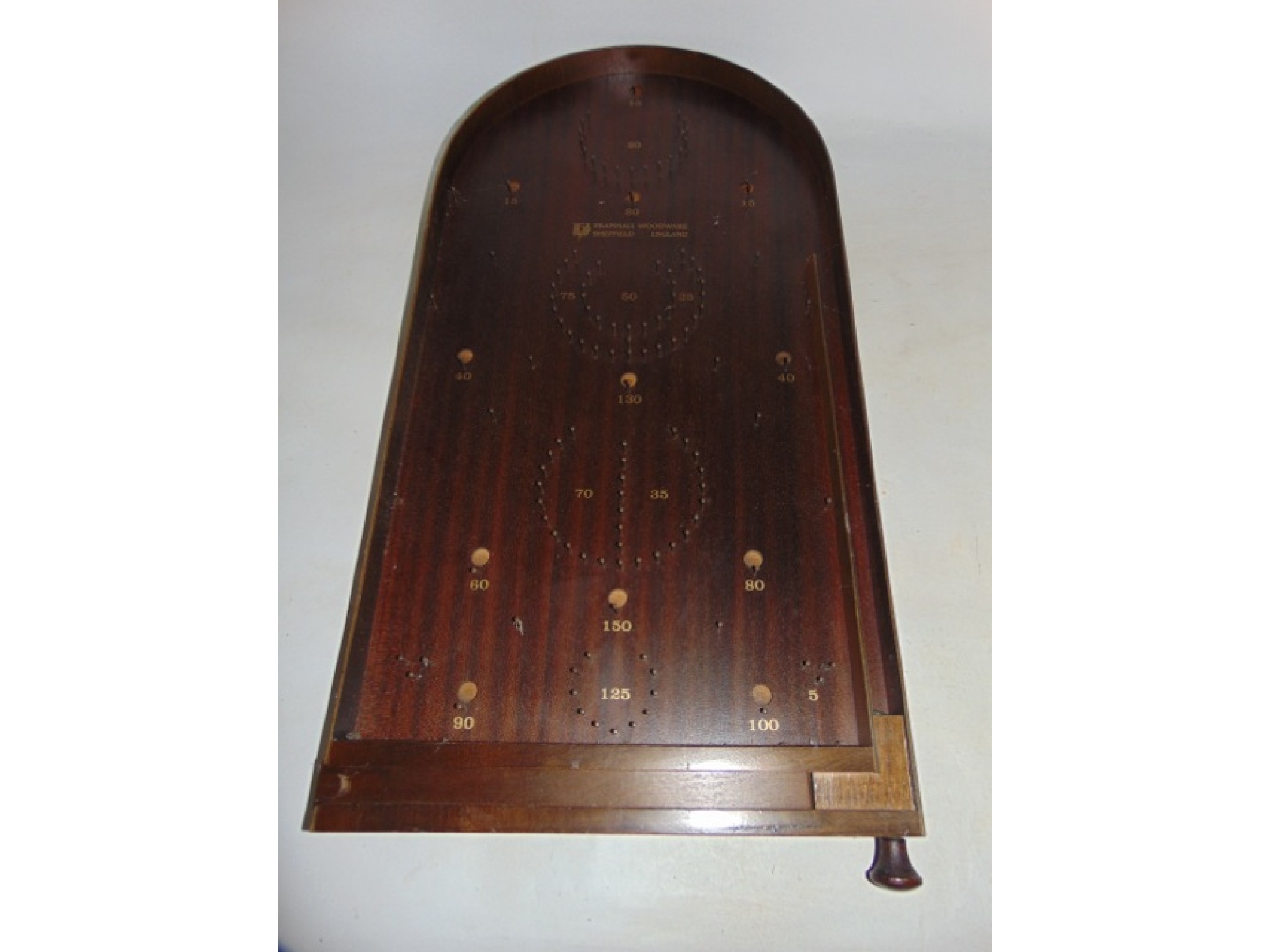 Appraisal: A th century timber bagatelle board marked Bramhall Woodware Sheffield