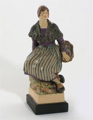 Appraisal: A pottery model of a mackerel seller by Joyce Bidder