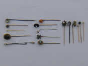 Appraisal: A mixed lot comprising sixteen untested stick tie pins including