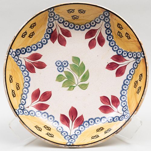 Appraisal: GROUP OF THREE CERAMIC SERVING DISHESComprising A large faience charger