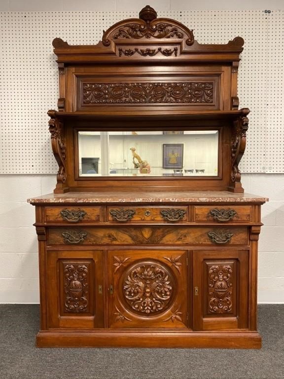 Appraisal: Victorian walnut sideboard with extensive carving and marble top circa