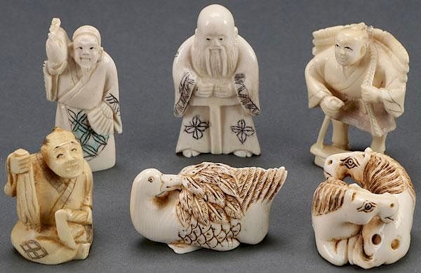 Appraisal: A COLLECTION OF SIX JAPANESE CARVED IVORY NETSUKE A COLLECTION