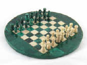 Appraisal: A circular green and white chess set and board