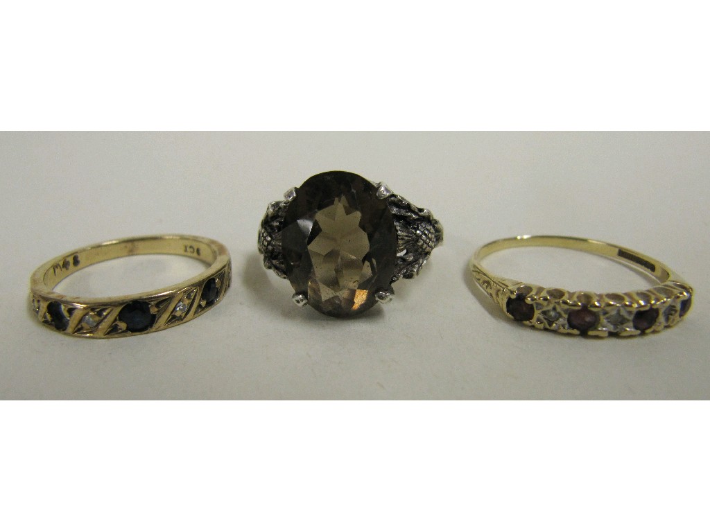 Appraisal: Lot comprising two ct gold half hoop rings with ruby