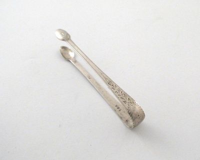 Appraisal: A pair of George III sugar tongs with pricked and