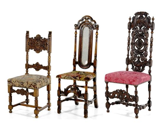 Appraisal: Three Continental carved fruitwood side chairs early th century ornately