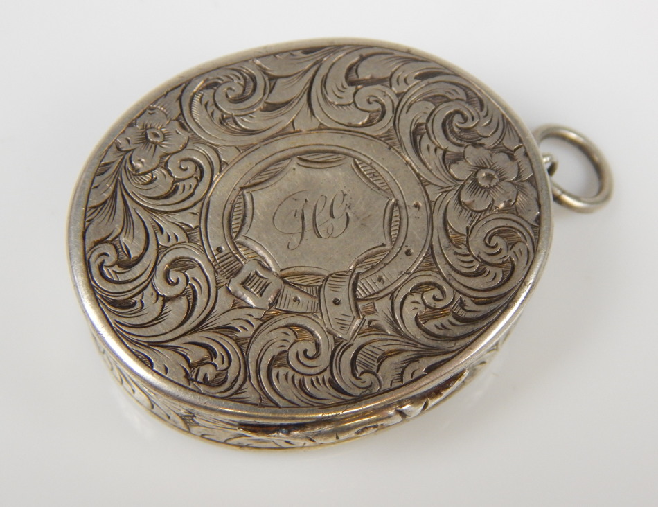 Appraisal: A Victorian silver vinaigrette with floral engraved casing and silver