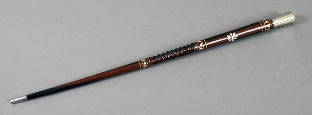 Appraisal: Pair of wood swagger sticks with plated end caps featuring