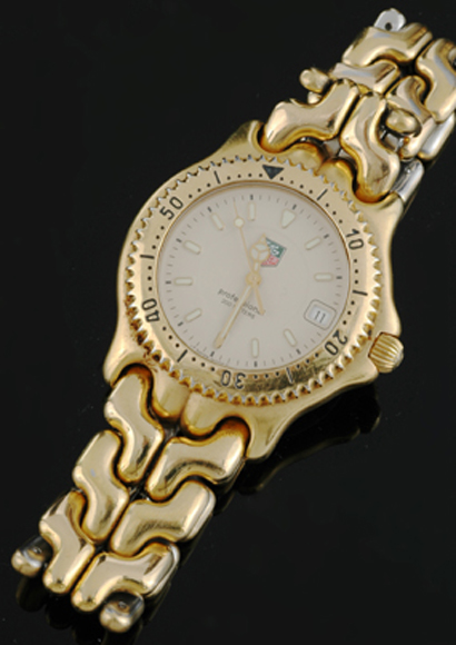 Appraisal: A Gents Tag Heuer wristwatch Quartz circular cream dial with