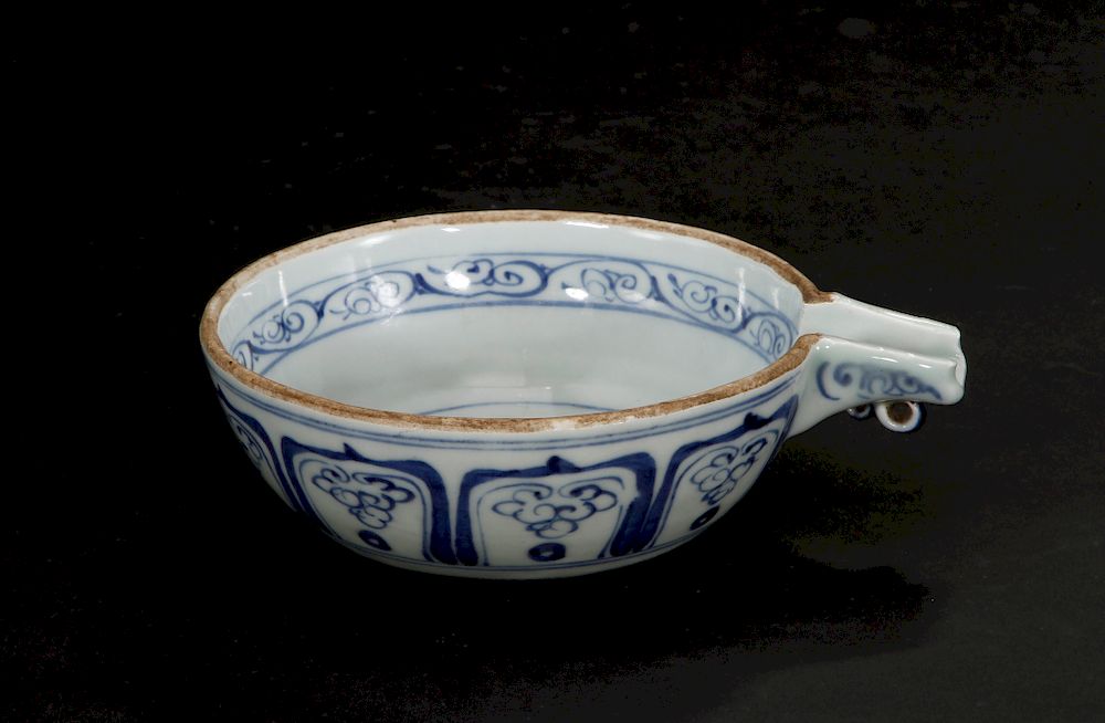 Appraisal: Blue and White Pouring Bowl Of shallow rounded form with