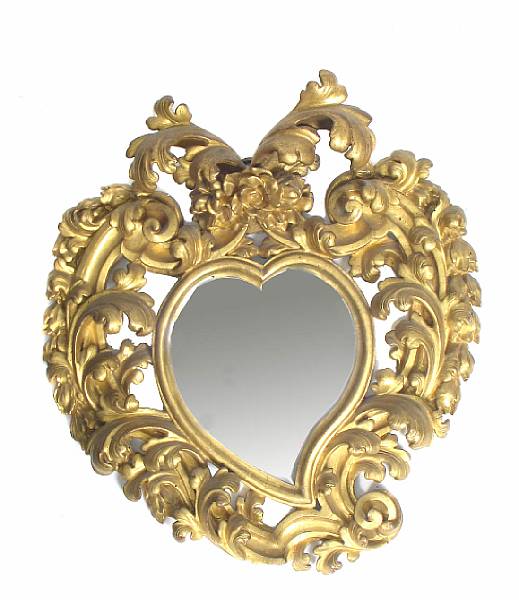 Appraisal: An Italian Rococo giltwood mirror of heart form height in