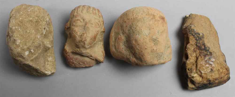 Appraisal: GROUP OF FOUR EGYPTIAN POTTERY FRAGMENTS including heads and another