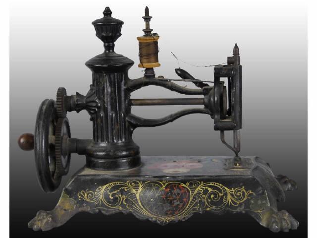 Appraisal: Cast Iron Floor Model Sewing Machine Description Cast iron clawed