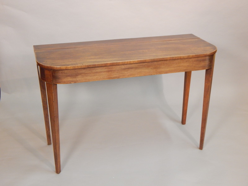 Appraisal: A George III mahogany serving table the rectangular top with