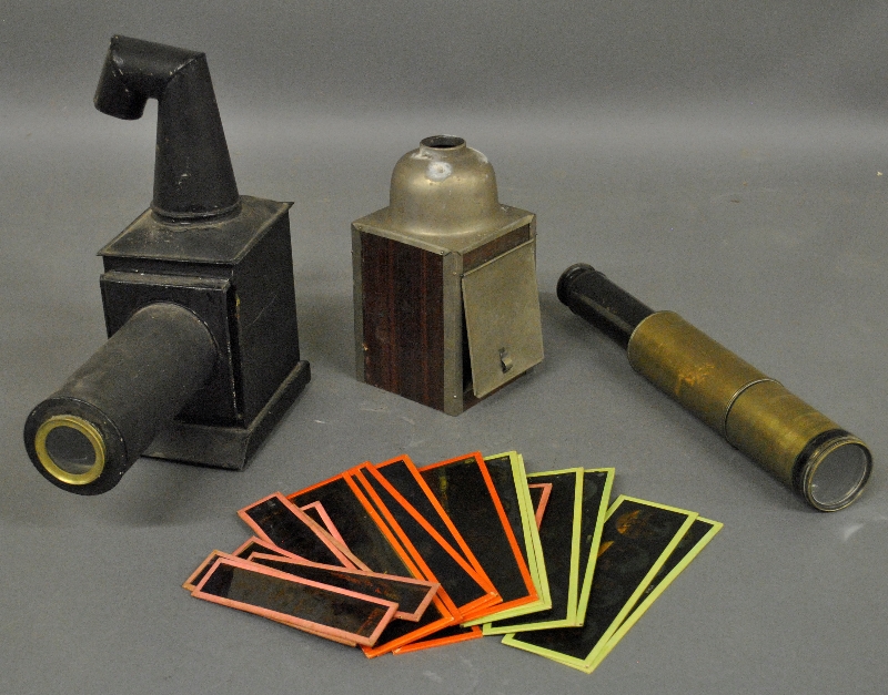 Appraisal: - Two magic lanterns with slides largest h and a