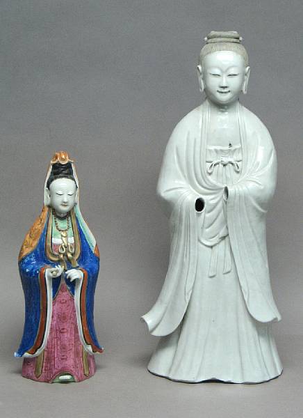 Appraisal: Two porcelain standing figures of Guanyin The larger figure covered