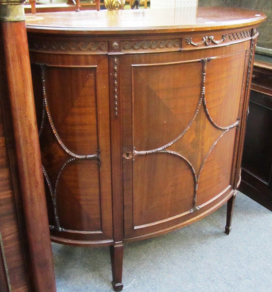 Appraisal: A pair of early th century mahogany demi-lune side cabinets