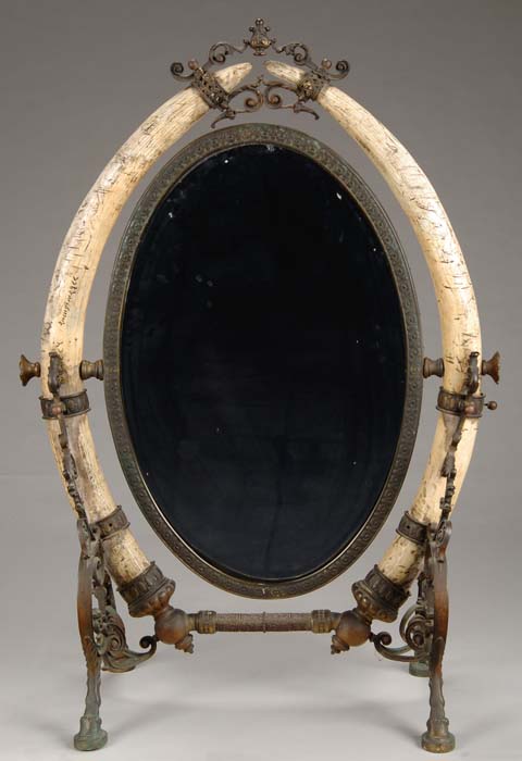 Appraisal: ANTIQUE BRONZE AND ELEPHANT TUSK FLOOR MIRROR Antique oval bronze