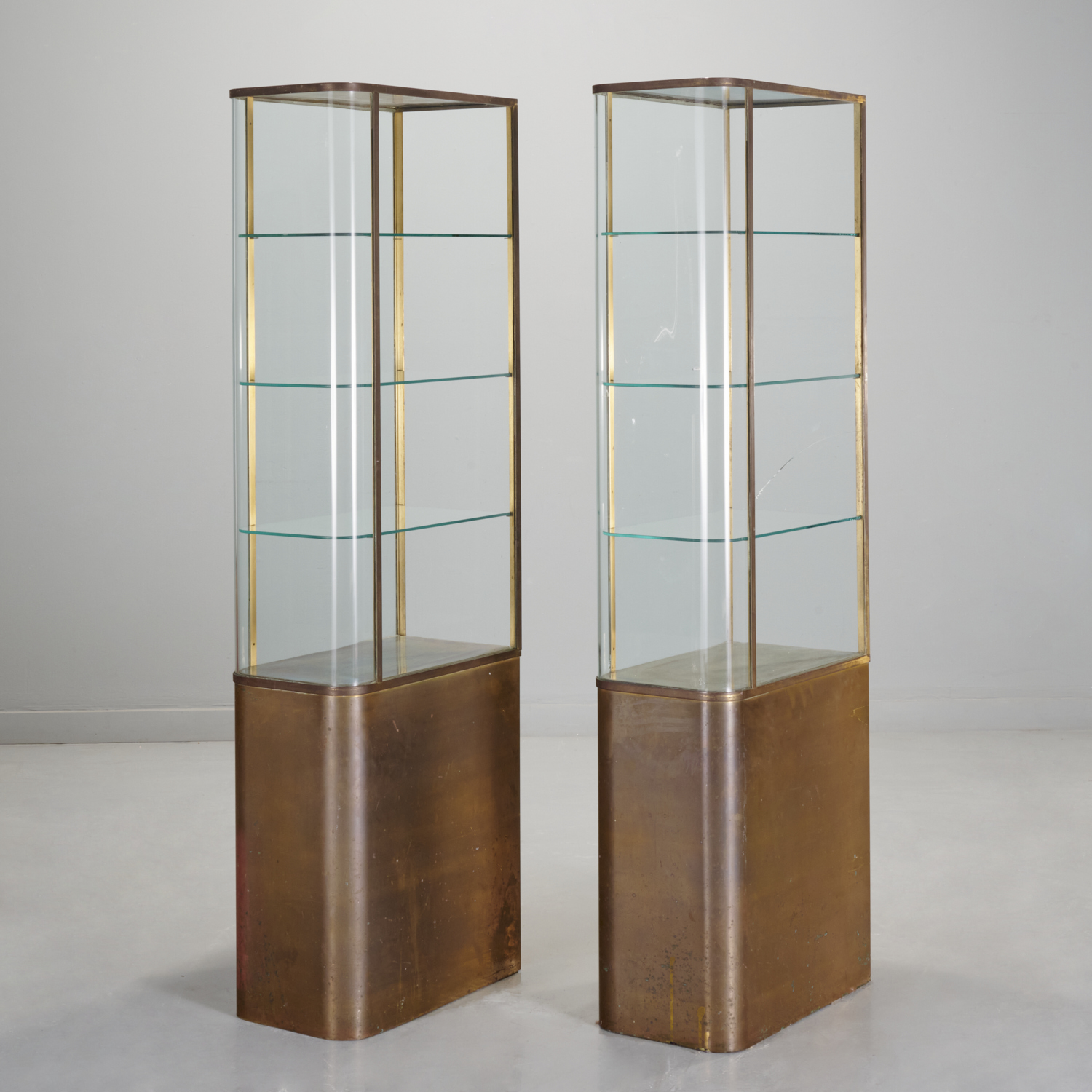 Appraisal: PAIR ART MODERNE BRASS AND GLASS VITRINES c s s