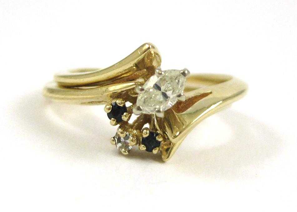 Appraisal: DIAMOND AND FOURTEEN KARAT GOLD WEDDING SET The engagement ring