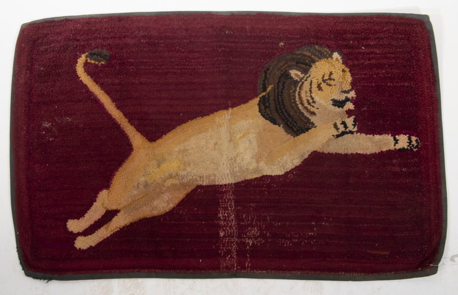 Appraisal: FIGURAL HOOKED RUG Free-hand 'Lion' shown leaping over a wine