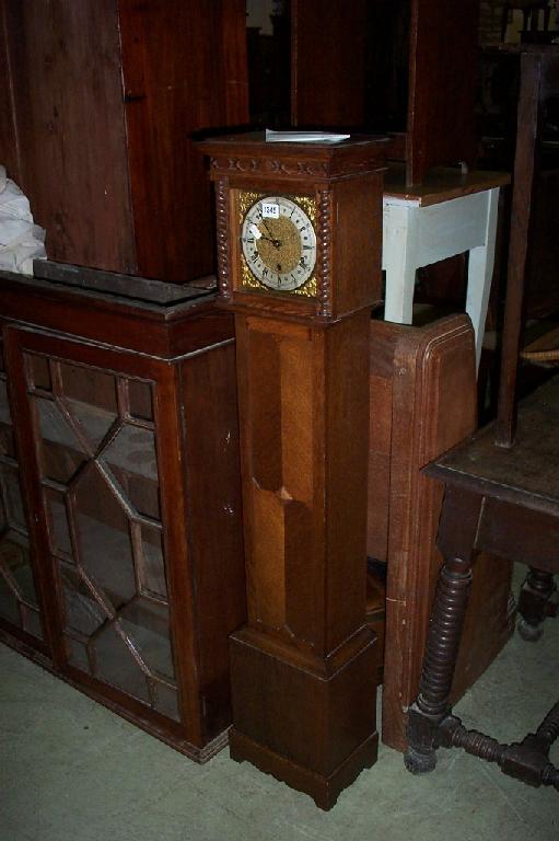 Appraisal: An oak grandmother clock with applied spiral twist decoration and