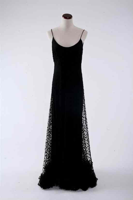 Appraisal: EVELYN BYRNES BLACK EVENING GOWN Sheer polka dot material draped