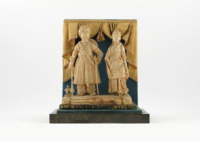 Appraisal: A balsa wood group of a Maharaja and Maharani standing