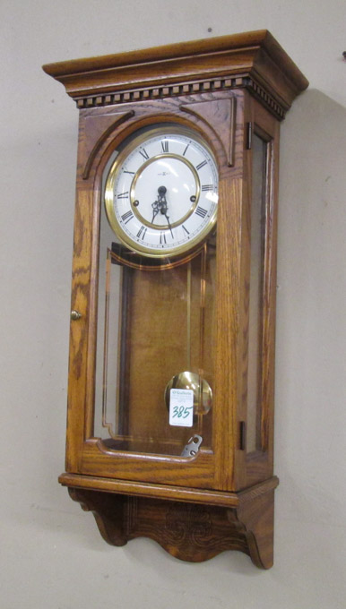 Appraisal: HOWARD MILLER OAK CASE WALL CLOCK Howard Miller Clock Co