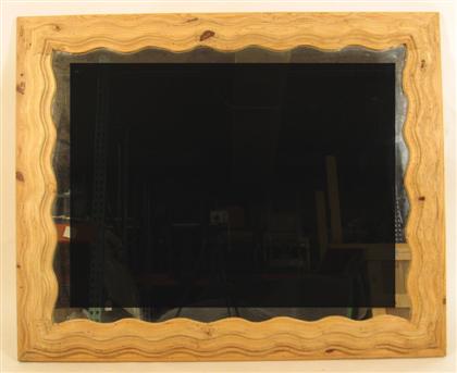 Appraisal: Stripped pine wall mirror Rectangular mirrorplate enclosed by a wavy