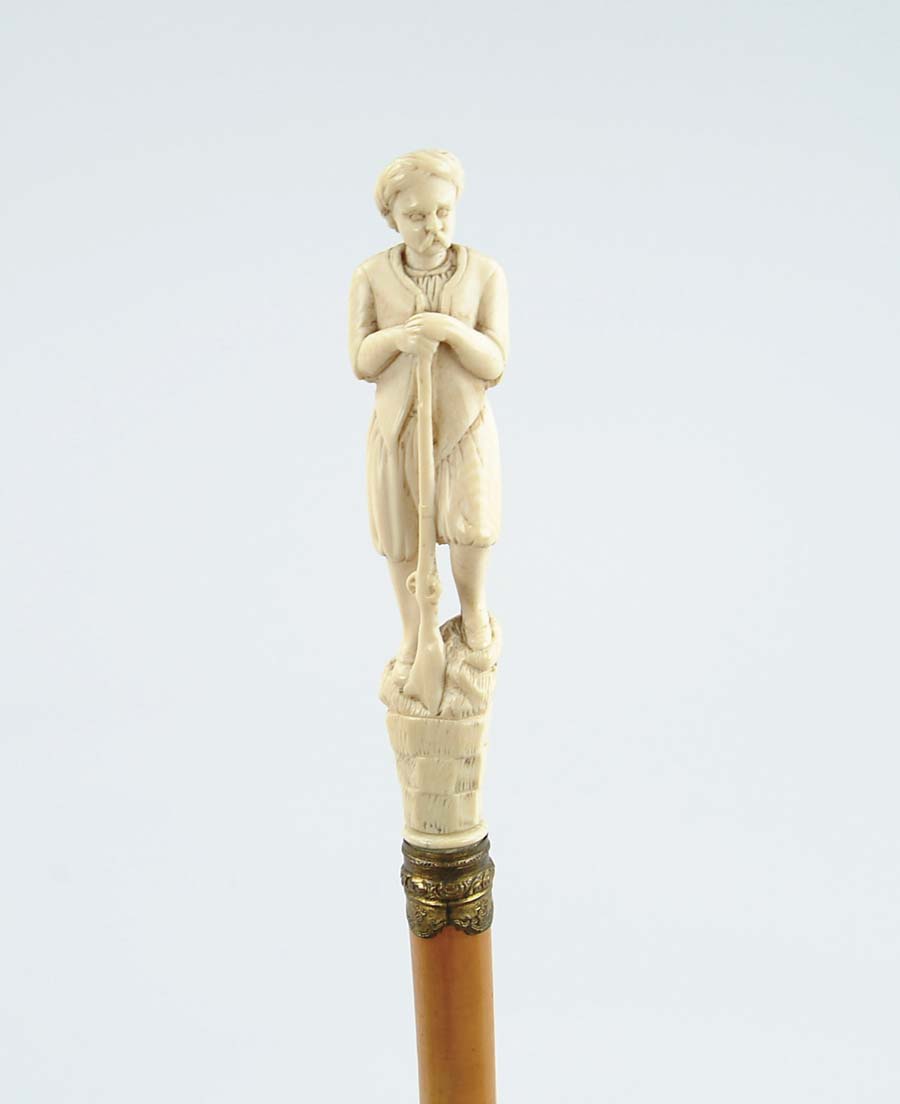 Appraisal: CANE CARVED IVORY ARAB MAN WITH GUN CANE - carved