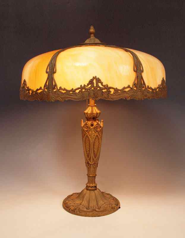 Appraisal: VINTAGE SLAG GLASS TABLE LAMP bent panel caramel glass and