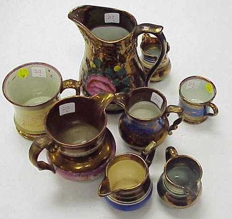 Appraisal: Eight pieces of copper lustreware pitcher with large handpainted rose