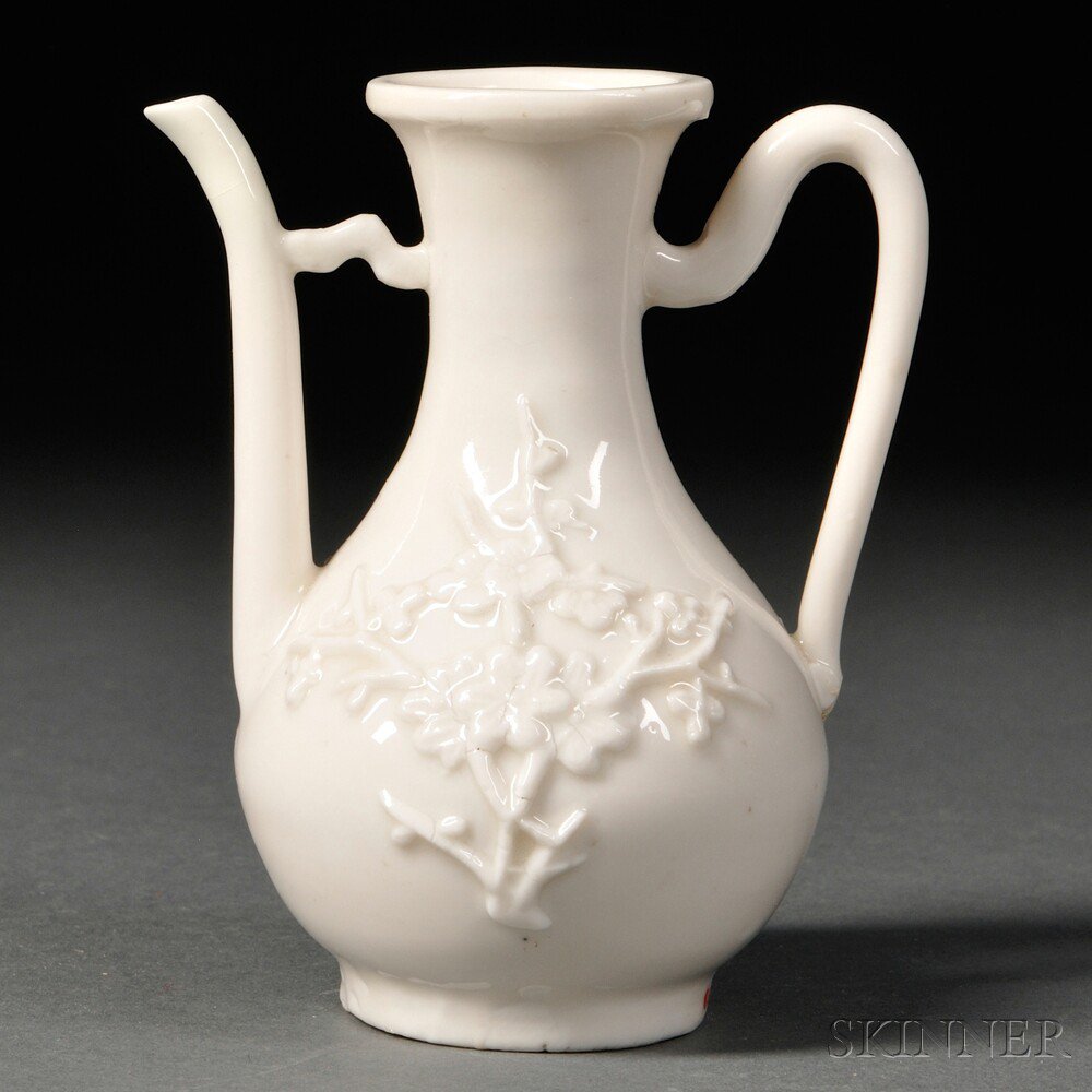 Appraisal: Blanc-de-Chine Ewer China Qing Dynasty decorated with applied prunus sprays