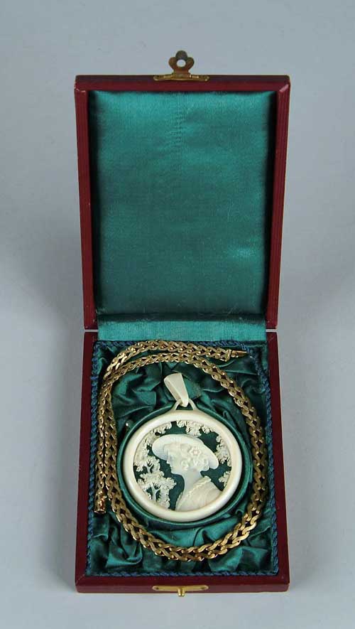 Appraisal: CARVED IVORY PENDANT OF YOUNG WOMAN ALONG WITH K YELLOW