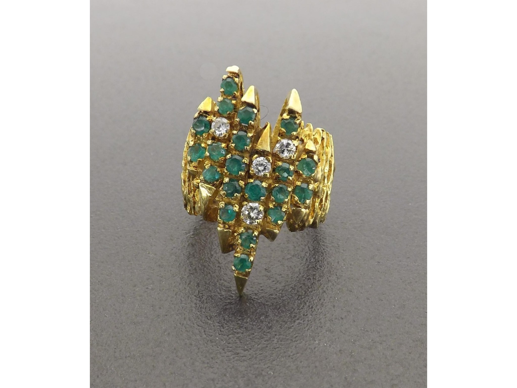 Appraisal: ct modernist textured emerald and diamond dress ring set with