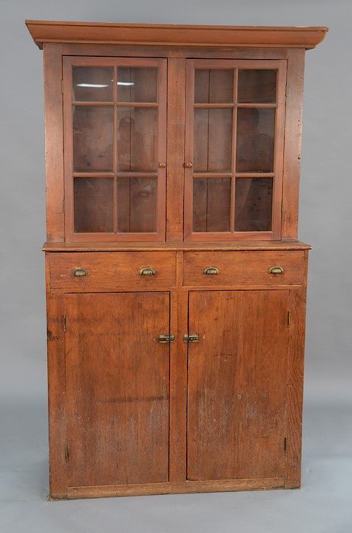 Appraisal: Primitive stepback cupboard having two glass doors over two drawers