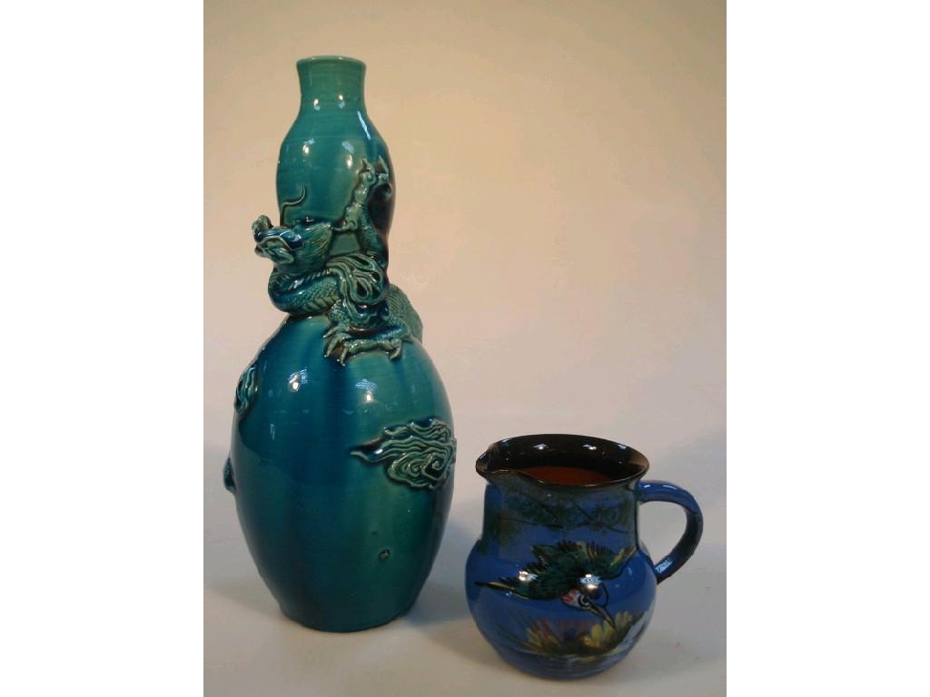 Appraisal: A Chinese turquoise ground Gourd vase applied in relief with